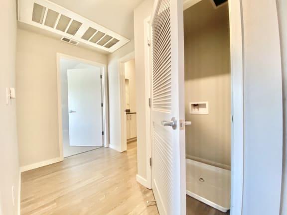 3 bed 2 bath hallway looking at washer/dryer closet