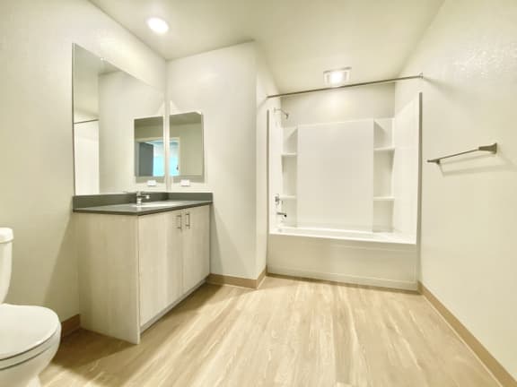 2 bed 2 bath bathroom with shower/tub combo