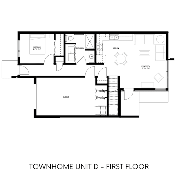 A black and white drawing of a house's first floor plan.