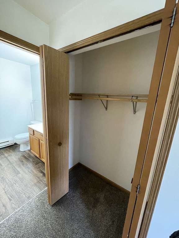a walk in closet in a 555 waverly unit