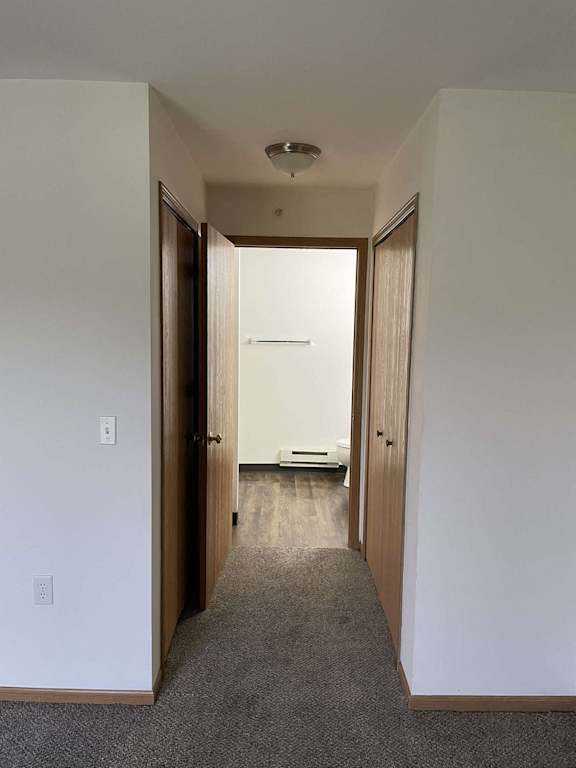 a look down the hall from the 2nd bedroom to the 3rd bedroom