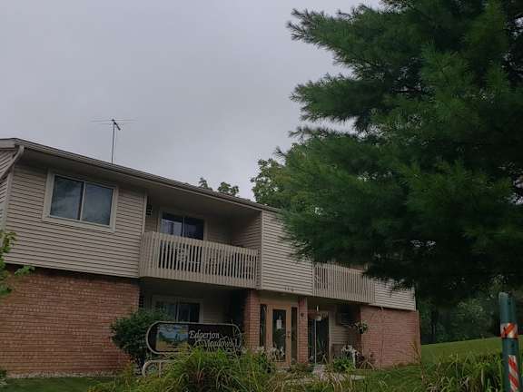 A house with a sign that says "Electronic" in front of it.