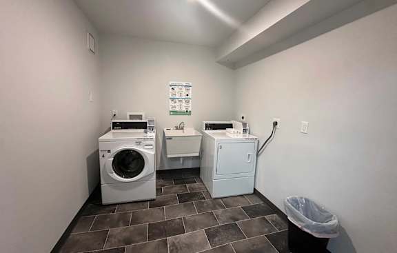 A laundry room with a washer and dryer.