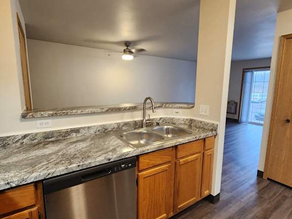 a kitchen with a sink and a dishwasher