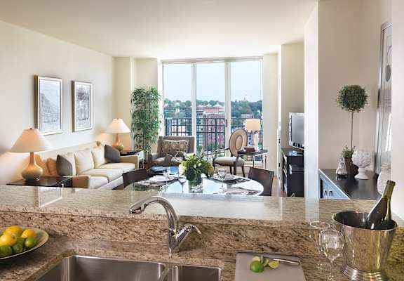 A modern kitchen with a view of the city.