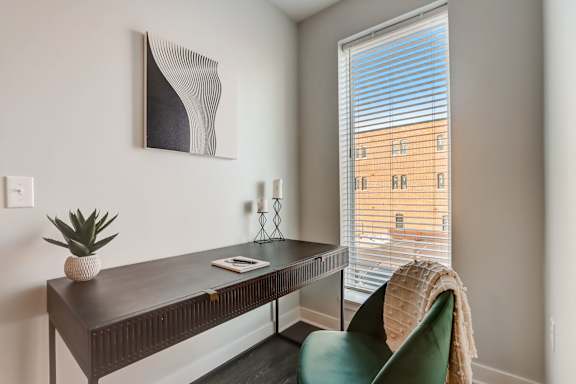 Desk with Chair and Window beside it at Wesmont, Indianapolis, 46202