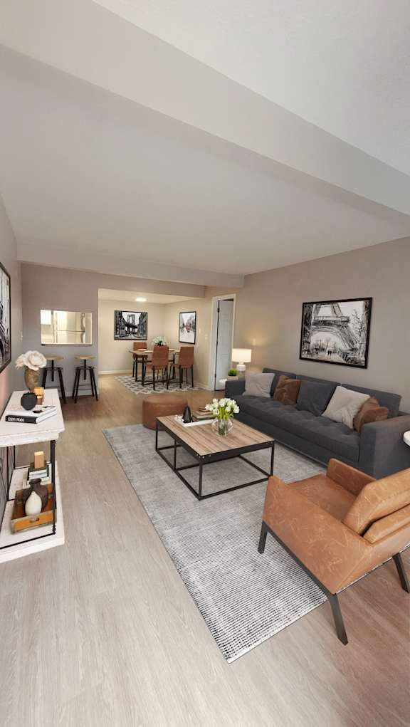 A modern living room with a grey rug and a brown leather chair.