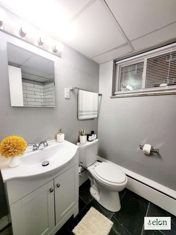 A bathroom with a white toilet and sink.
