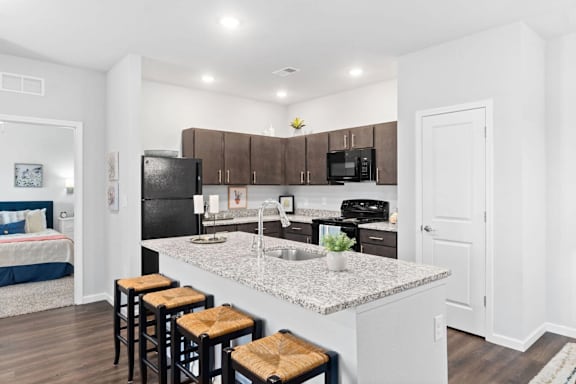 Kitchen with black refrigerator at Highview Pointe, Kentucky, 40228