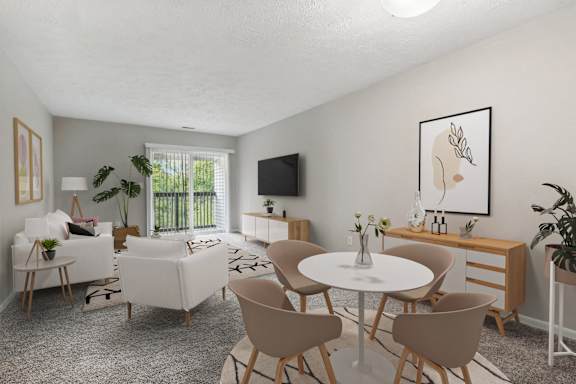 A living room with a white table and chairs.