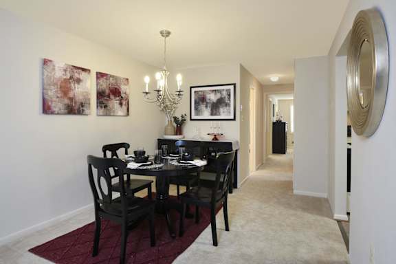 A dining room with a table set at Cromwell Valley Apartments, Towson