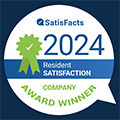 A blue and white circular badge indicating a company award winner for resident satisfaction in 2024.