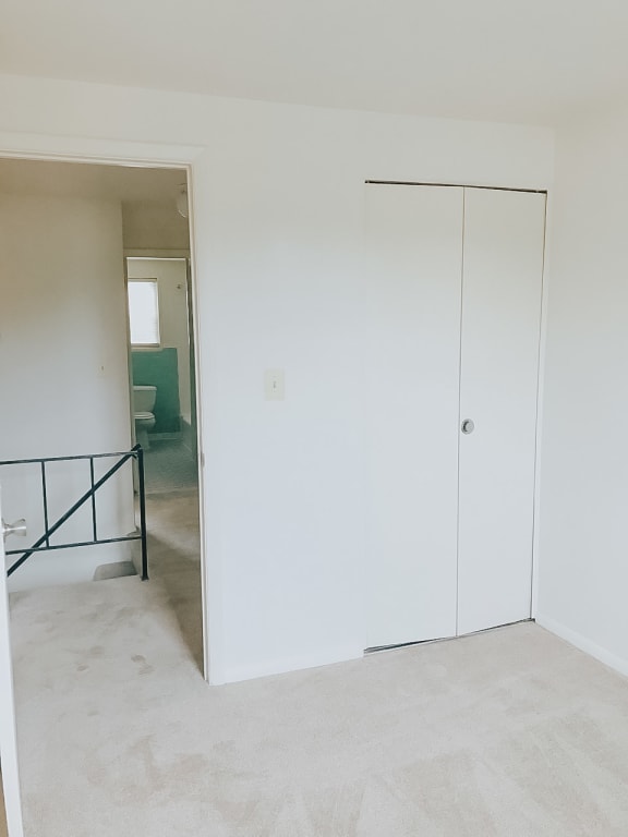Bedroom with a white wall and a white door at Hyde Park Apartments*, Essex