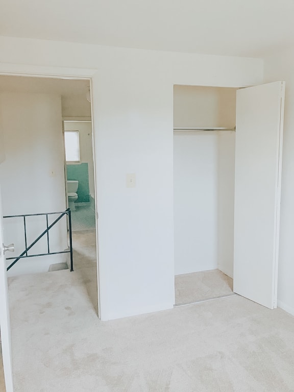 Bedroom with white walls and white carpet at Hyde Park Apartments*, Essex Maryland