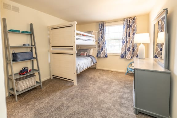 a bedroom with a bunk bed and a desk with a lamp at Chapel Valley Townhomes, Baltimore, 21236