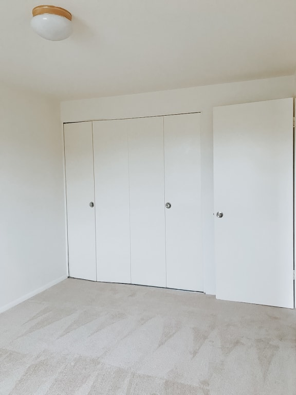 Bedroom with white walls and white closets at Hyde Park Apartments*, Essex, 21221