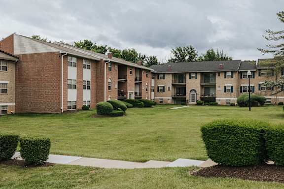A large grassy area in front of apartment buildings at Deer Park Apartments, Randallstown, 21133