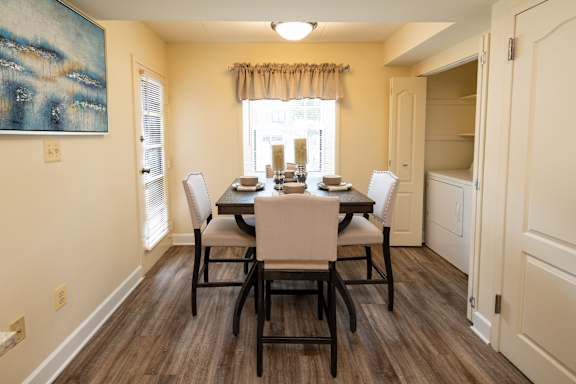 A dining room with a table set for four  at Ivy Hall Apartments*, Maryland, 21204