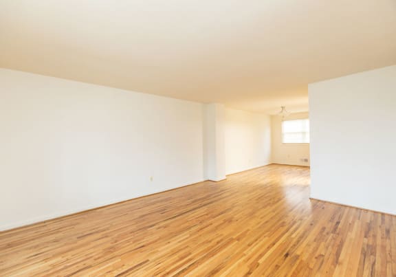 Living Room with hardwood floors and white walls at Foxridge Townhomes, Baltimore, MD 21221