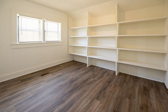 Room with white shelves and a window at Ivy Hall Apartments*, Towson, 21204