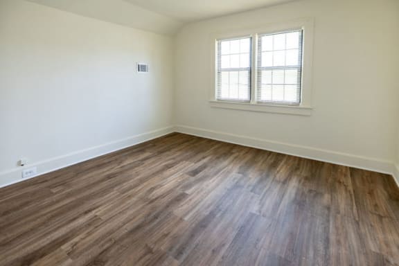 a bedroom with hardwood flooring at the oxford at estonia apartments in san an at Ivy Hall Apartments*, Maryland, 21204