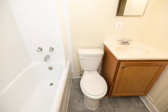 a bathroom with a toilet sink and bathtub at Ivy Hall Apartments*, Towson