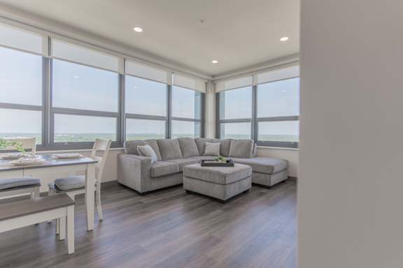 A modern living room with a dining table and a couch.