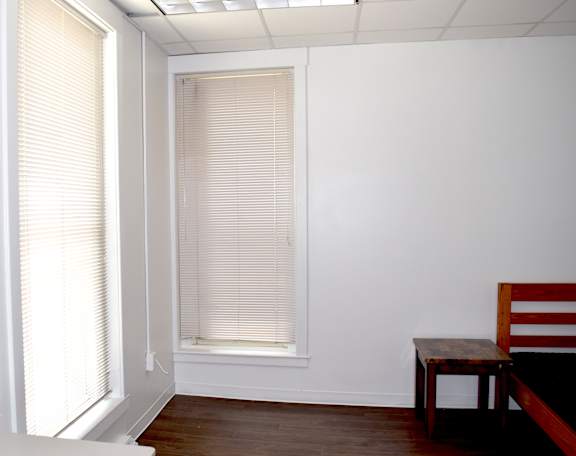 A room with a table and a chair.