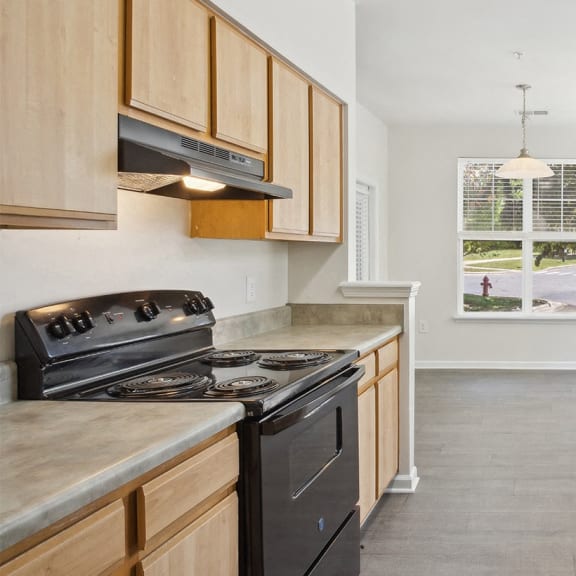 Kitchen with black appliances at Magnolia Pointe Apartments in Durham NC