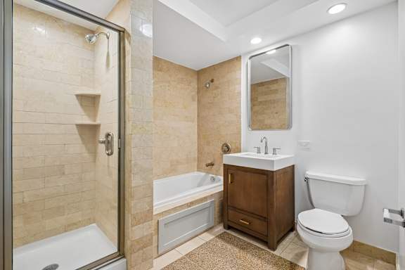 A bathroom with a walk-in shower and a toilet.
