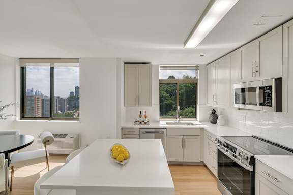 A modern kitchen with a large island in the center.