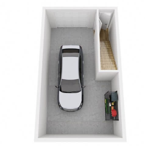A car is parked in a small garage.