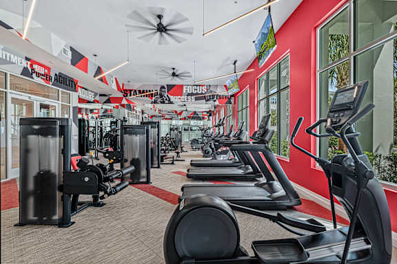 A gym with treadmills and other exercise equipment.at Altis Grand Lake Willis, Orlando Florida