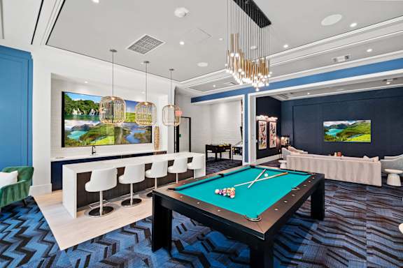 A room with a pool table and a television at Altis Santa Barbara, Florida
