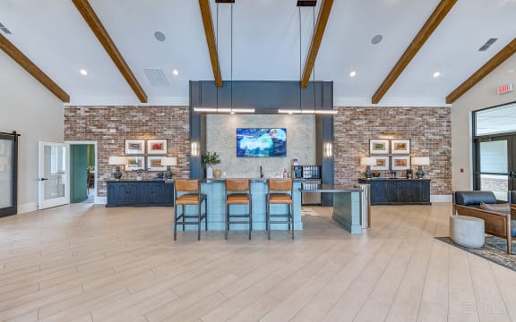 the preserve at ballantyne commons clubhouse with bar and living room