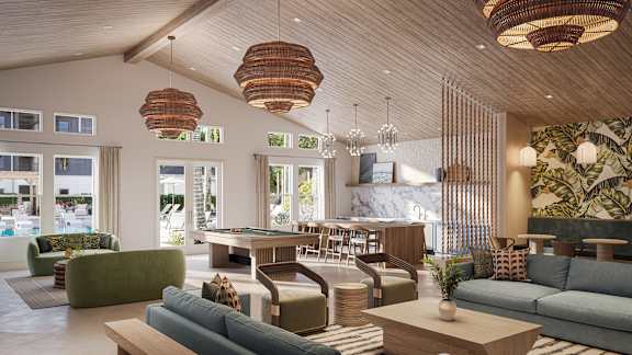 Dog-Friendly Luxury Apartments in Bradenton, FL - Eventide Apartments - Lounge With Vaulted Wood Ceilings, Large Windows, Woven Pendant Lights, and a Billiards Table.