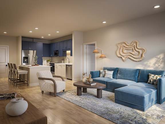 A modern living room with a blue couch and a wooden coffee table.