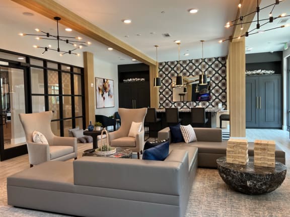 a living room with couches and chairs and a table