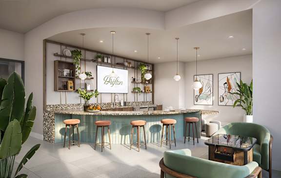 A modern bar with green stools and a white wall.