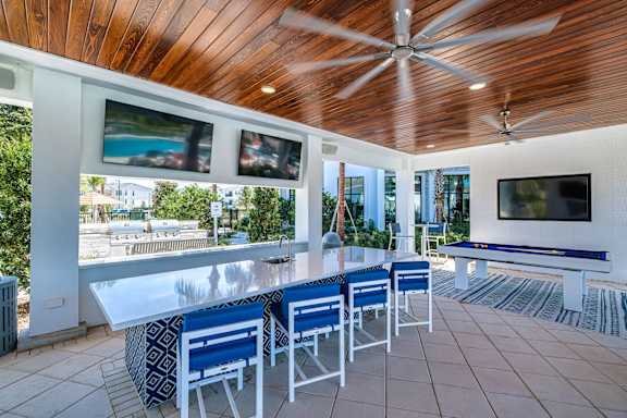 a bar area with a pool table and a television at Altis Twin Lakes Apartments, Florida, 34744