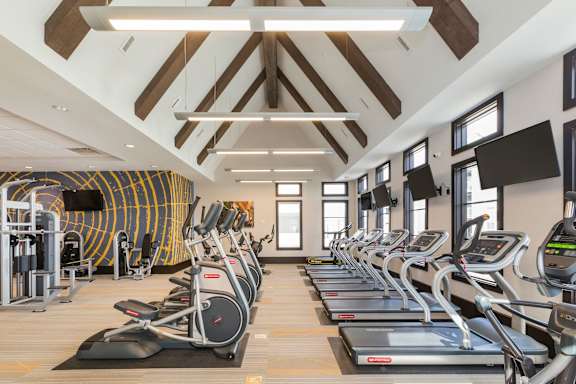 A gym with treadmills and exercise equipment.