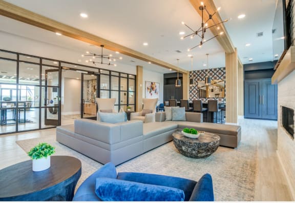 a living room with couches and chairs and a table