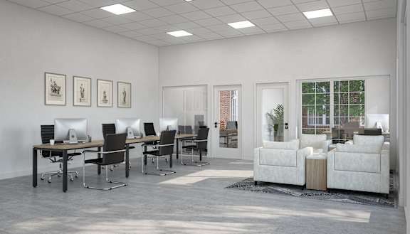 A white room with black chairs and a white couch.