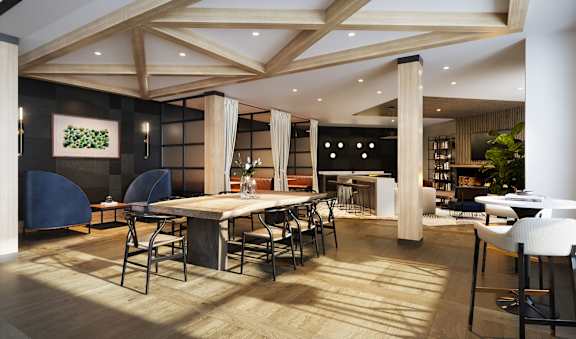 a dining room with a large table and chairs