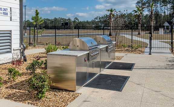 A metal grill is in front of a sign that says "School District 12".
