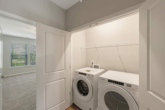A laundry room with a washer and dryer.