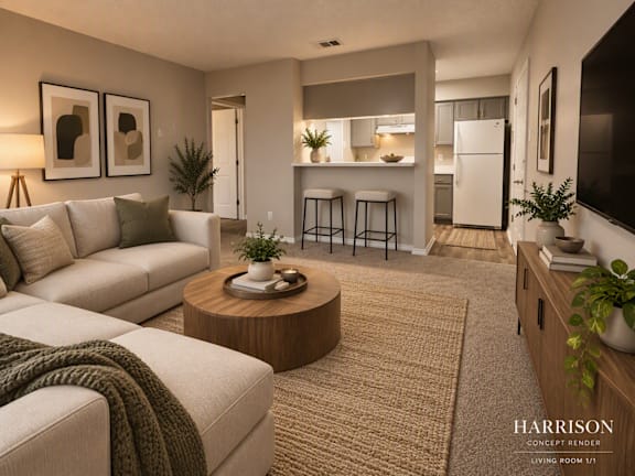 A modern living room with a white couch, a coffee table, and a television.