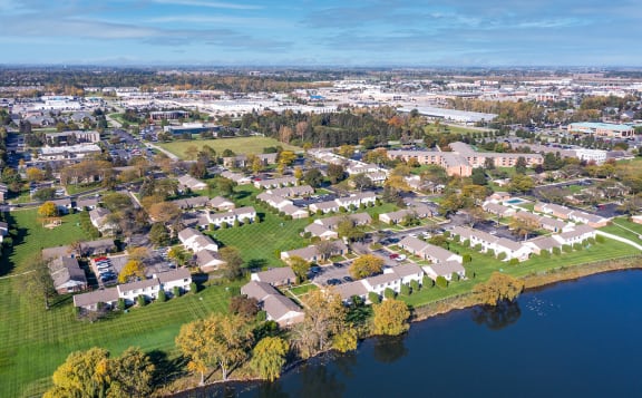 an aerial view of a neighborhood near a body of water