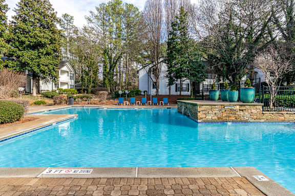 A pool with a 3 ft deep sign on the side.