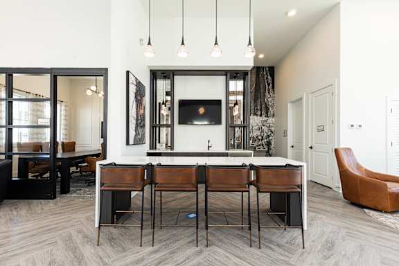 A modern living room with a fireplace and a dining table.